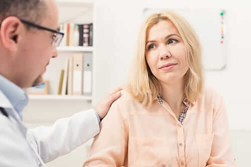 woman talking with her doctor at an alcohol addiction treatment 