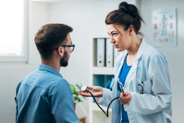Woman Doctor talking to Patient at her Medical Office most abused prescription drugs